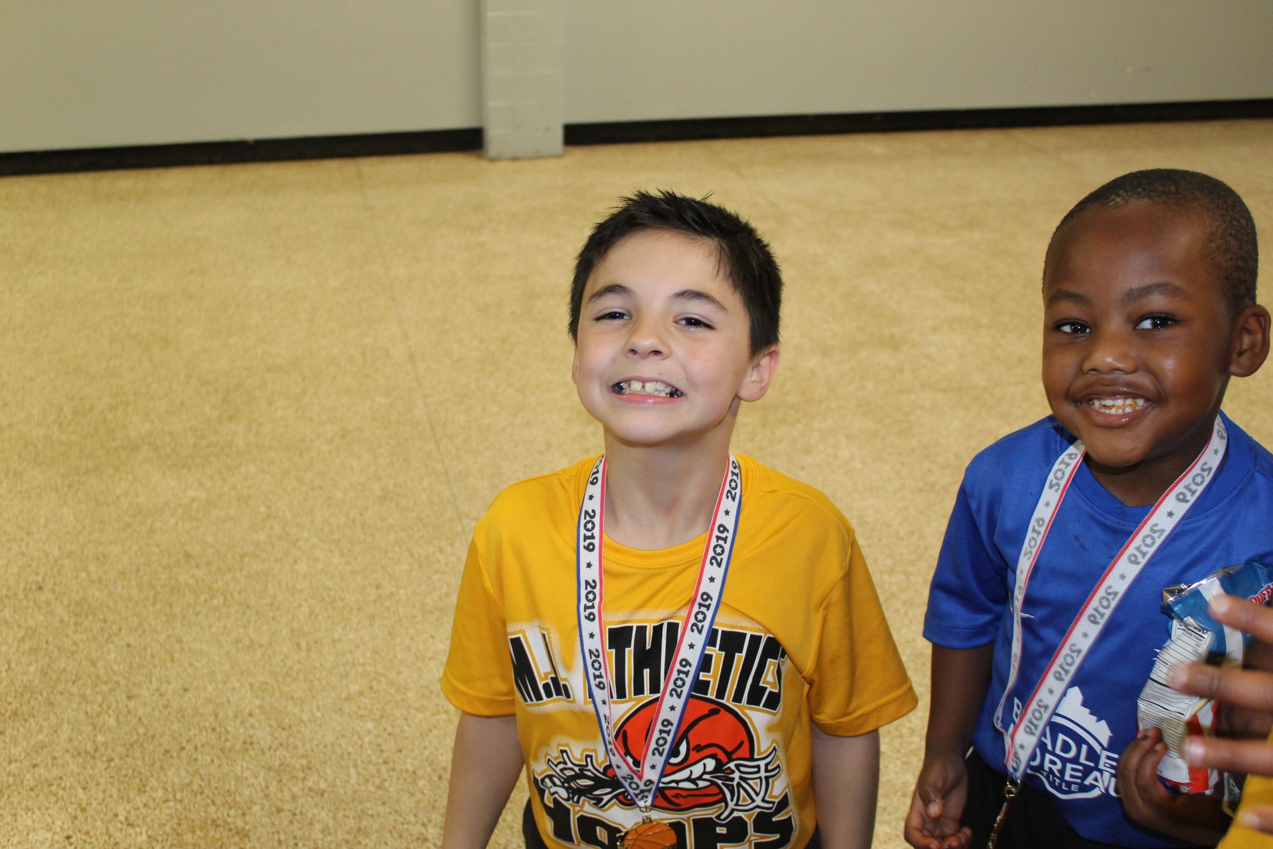Two young athletes with medals after competition